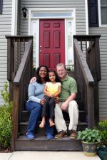 Family in front of home